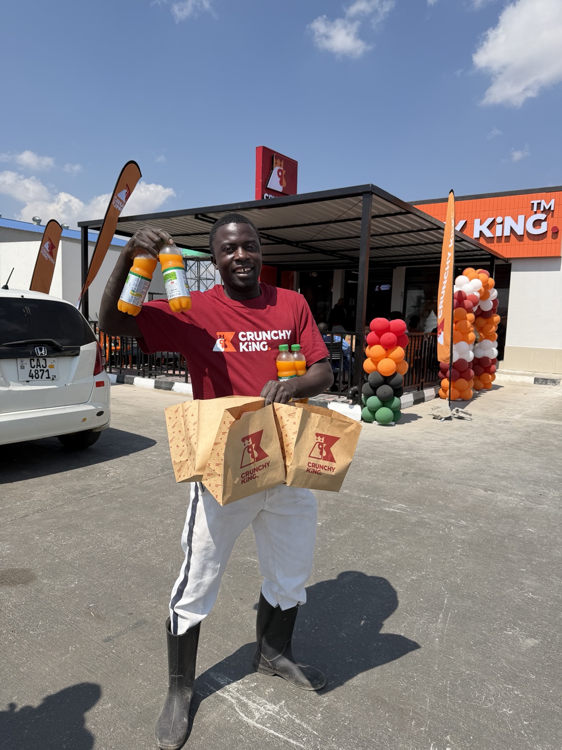 Happy customer with CrunchyKing takeaway meals and drinks at Bonaventure